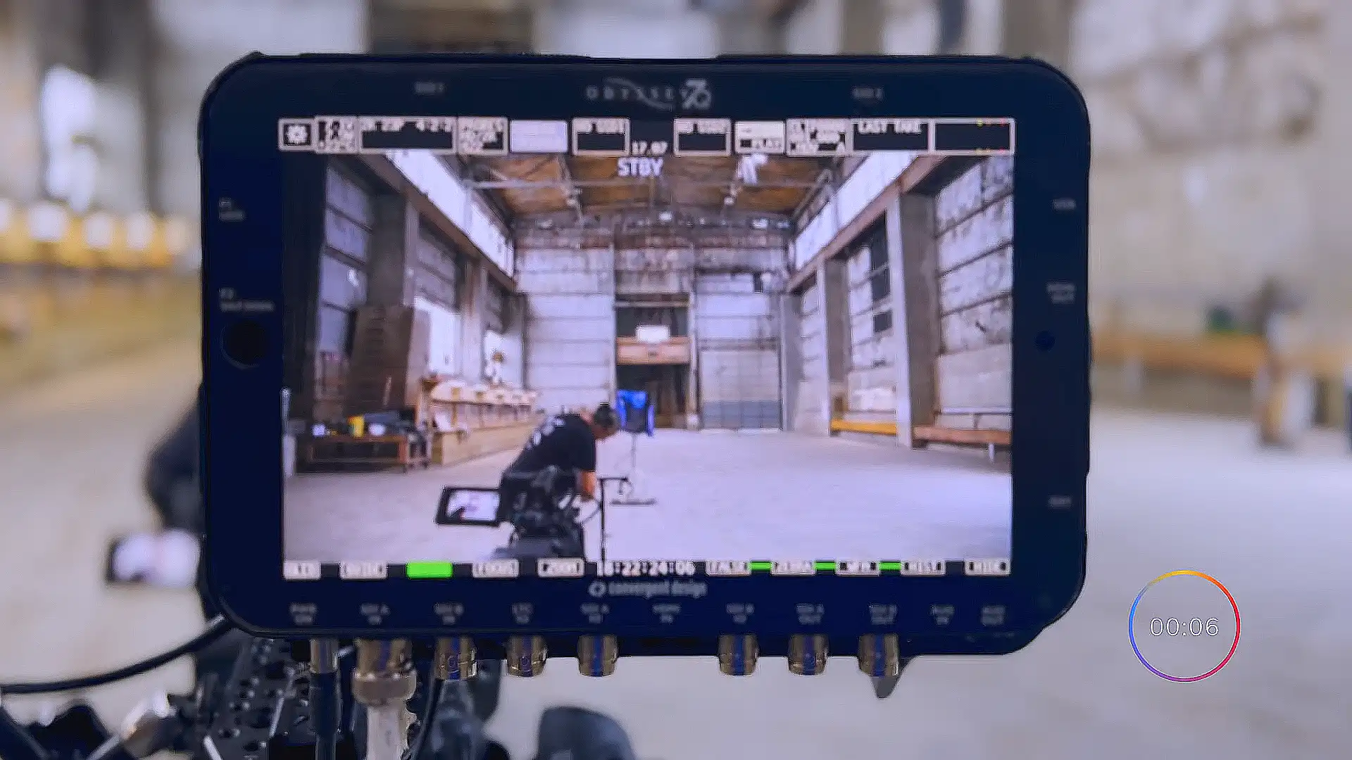 image of a camera monitor showing camera crew setting up